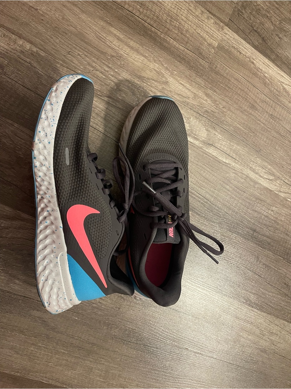 Nike Women’s Black Running Sneakers with Pink Swoosh and Blue Accent